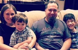 The Lewinski family sits together on a couch.