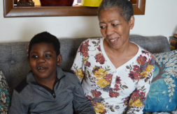 Nedra Whitted smiles at her grandson Stanton as the two sit together