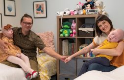 Erica Stearns and her husband hold hands while they each hold one of their two children with complex medical needs
